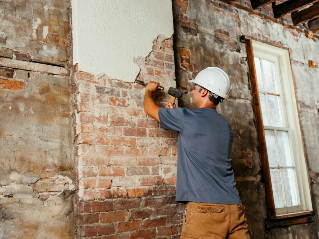 A photo of a Wentworth Construction team member working on a renovation.